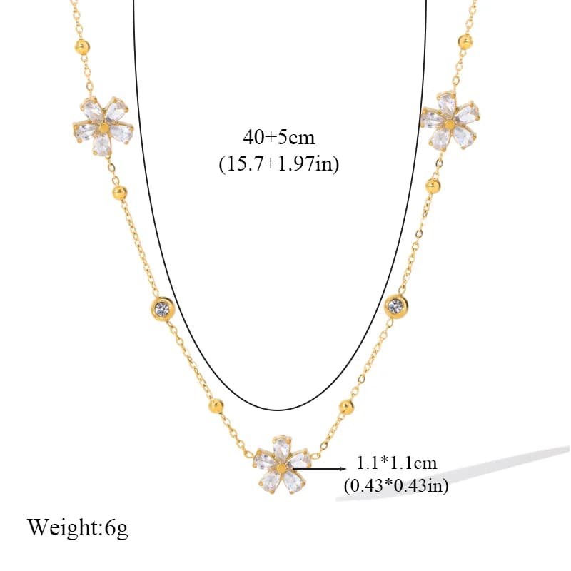 Set gioielli con fiori in zirconia bianca