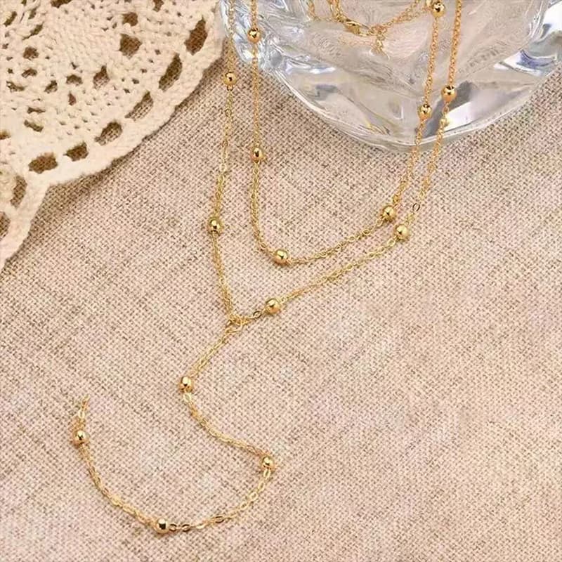 Collana pendente a Y lunga delicata con sfere dorate