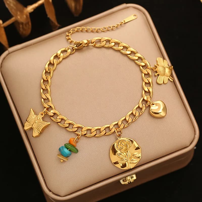 Braccialetto charm fiore e stella con perle