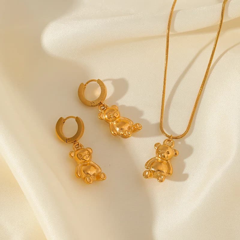 Set collana e orecchini orso e fiore, Oro