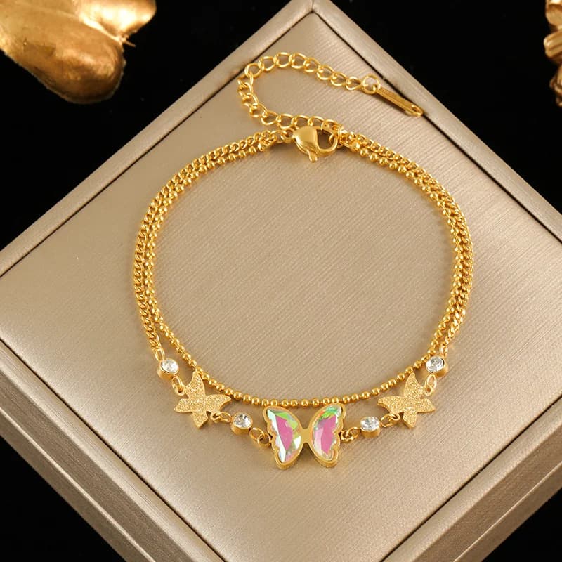 Braccialetto charm fiore e stella con perle