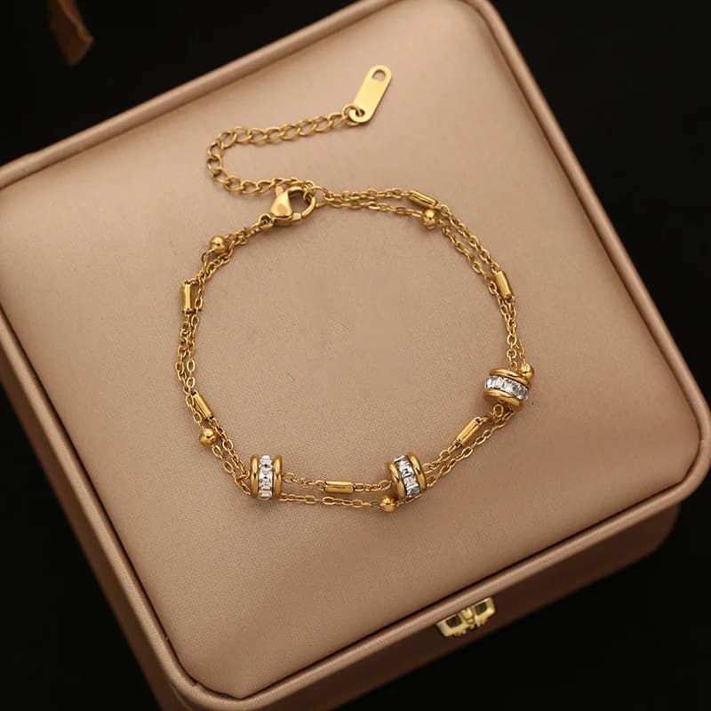Bracciale rigido a catena con sfere dorate