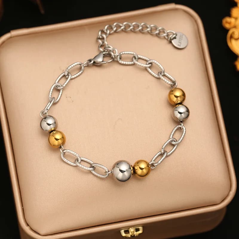 Bracciale rigido a catena con sfere dorate
