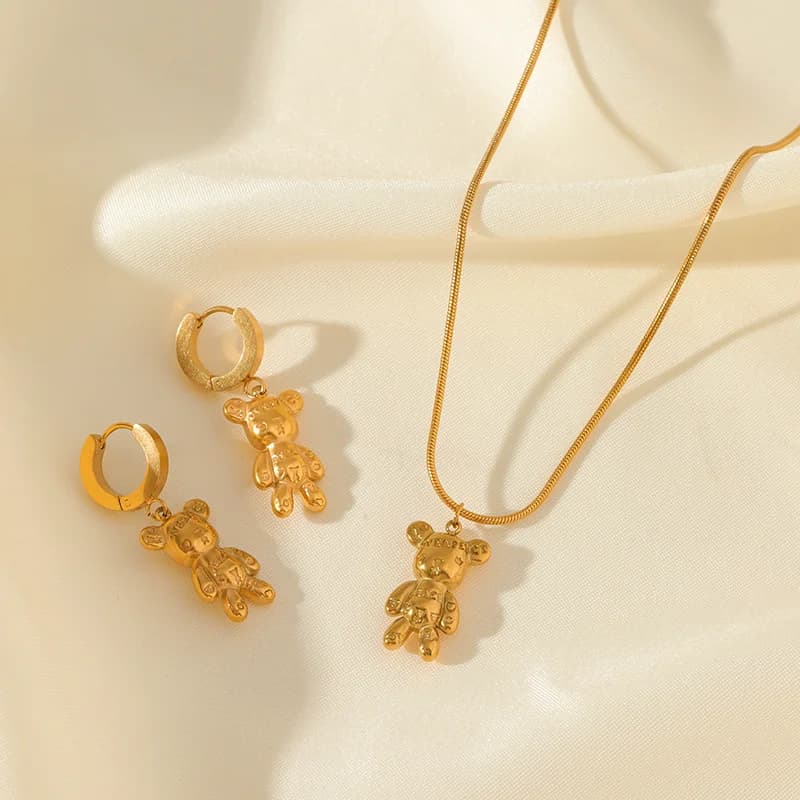 Set collana e orecchini orso e fiore, Oro
