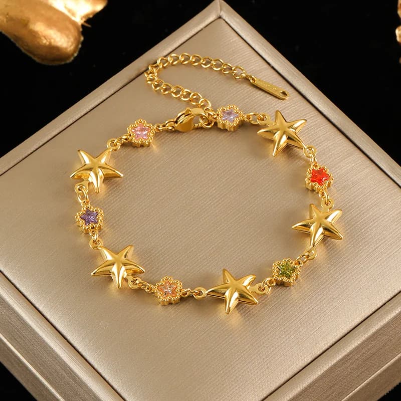Braccialetto charm fiore e stella con perle