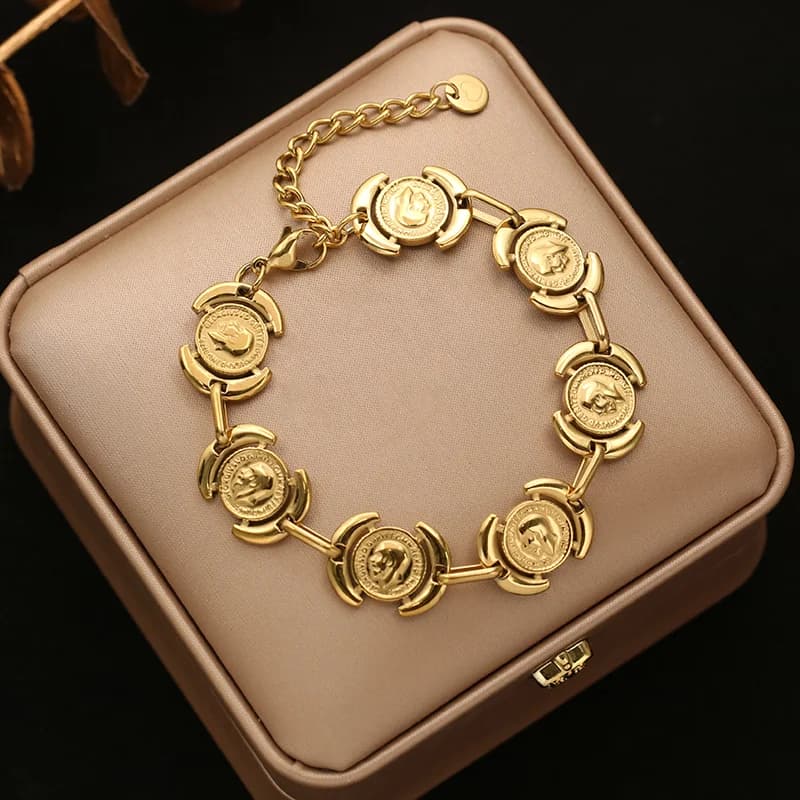 Bracciale rigido a catena con sfere dorate