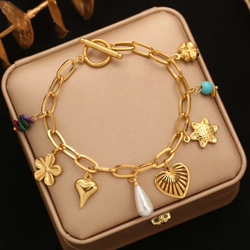 Braccialetto charm fiore e stella con perle