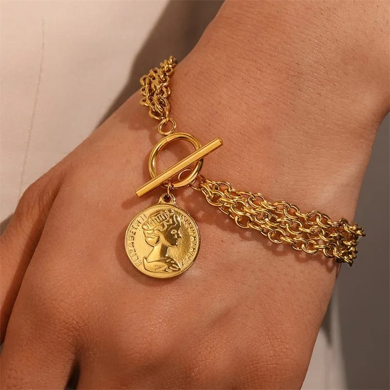 Bracciale con ciondoli a moneta in acciaio inox 316L color oro
