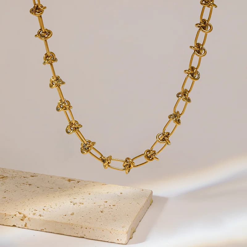 Set Collana e Bracciale con Catena Annodata, Oro