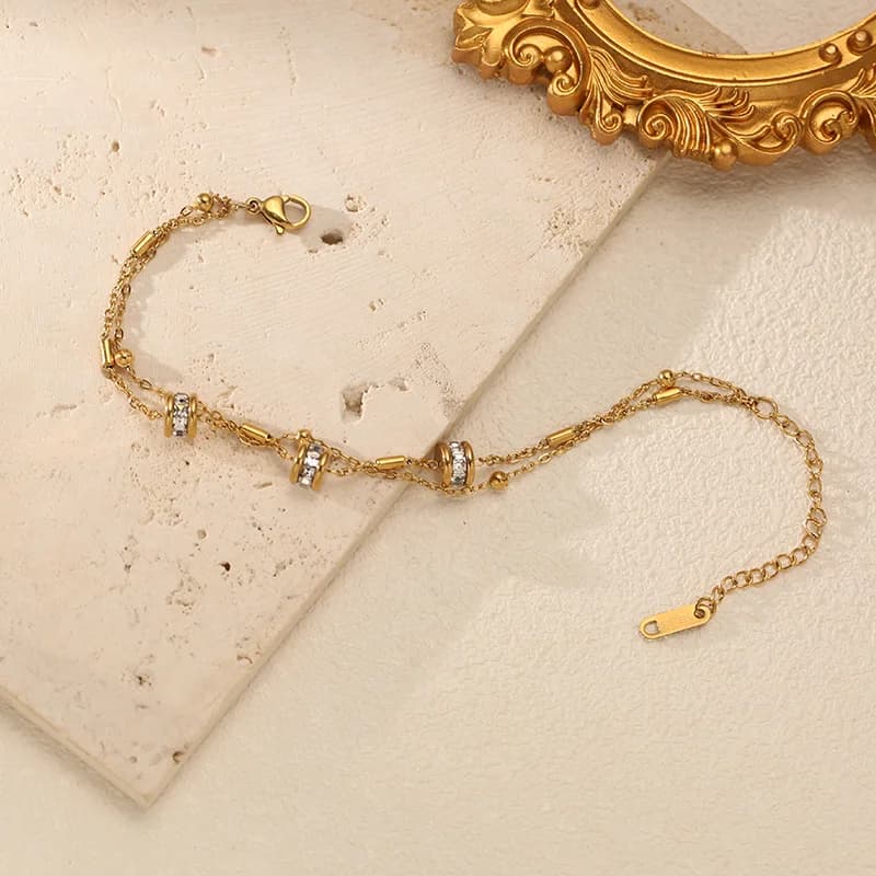 Bracciale con perline in zirconi sintetici placcato oro 18K