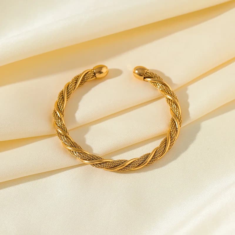 Bracciale rigido regolabile intrecciato in acciaio inox 316L color oro