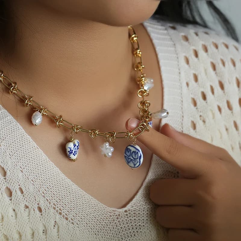 Collana a goccia con perla e celadon in acciaio inox 316L color oro