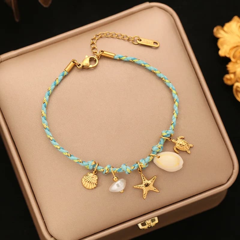Bracciale con charms stella marina e conchiglia su cordino