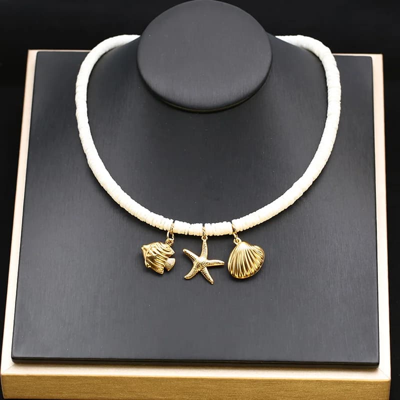 Collana con pendente stella marina e tartaruga in oro