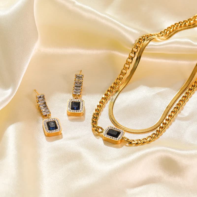 Set collana e orecchini con catena snake e zirconi blu