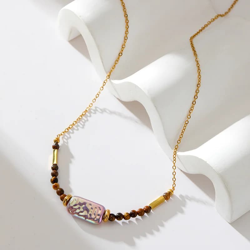 Collana con pendente in acciaio inox e pietra marrone
