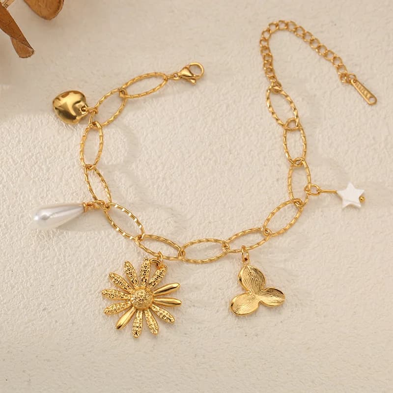 Bracciale herringbone con charm fiore e perla, placcato oro 18K