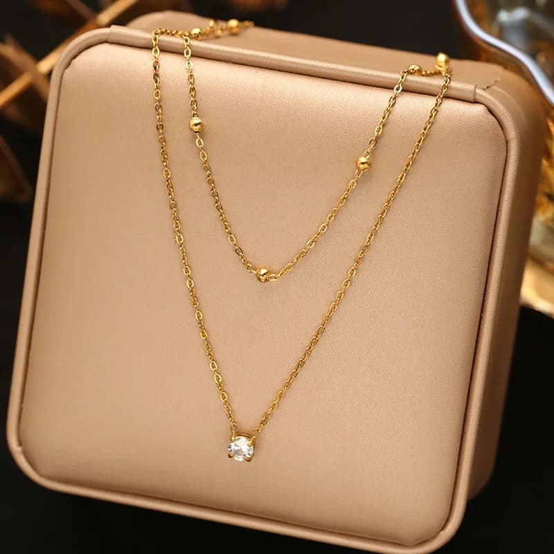 Collana pendente a Y lunga delicata con sfere dorate
