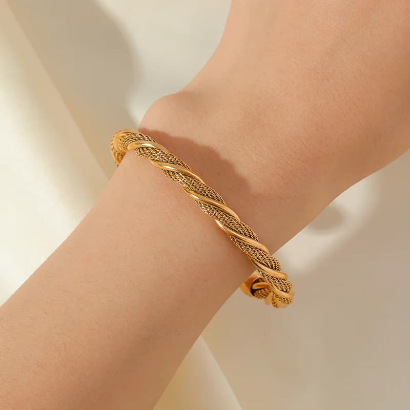 Bracciale rigido regolabile intrecciato in acciaio inox 316L color oro