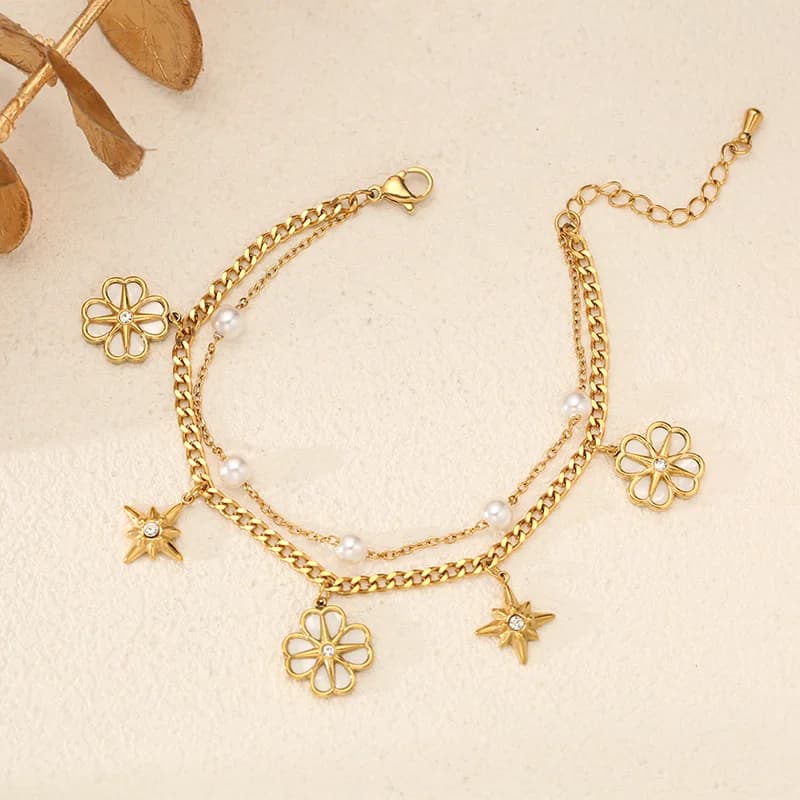 Braccialetto charm fiore e stella con perle