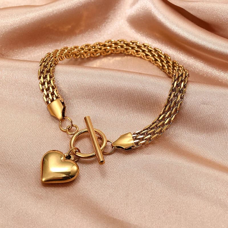 Bracciale rigido con ciondoli a cuore in acciaio inox