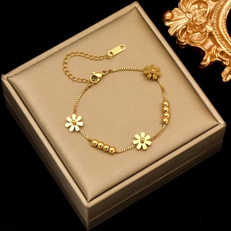 Bracciale charm con petali di fiore, color oro