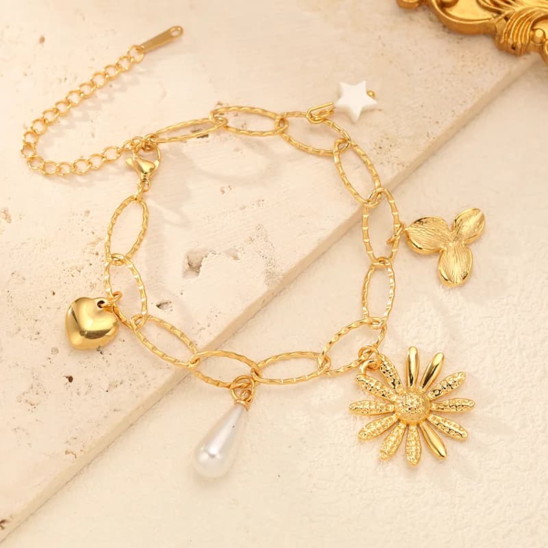 Bracciale herringbone con charm fiore e perla, placcato oro 18K