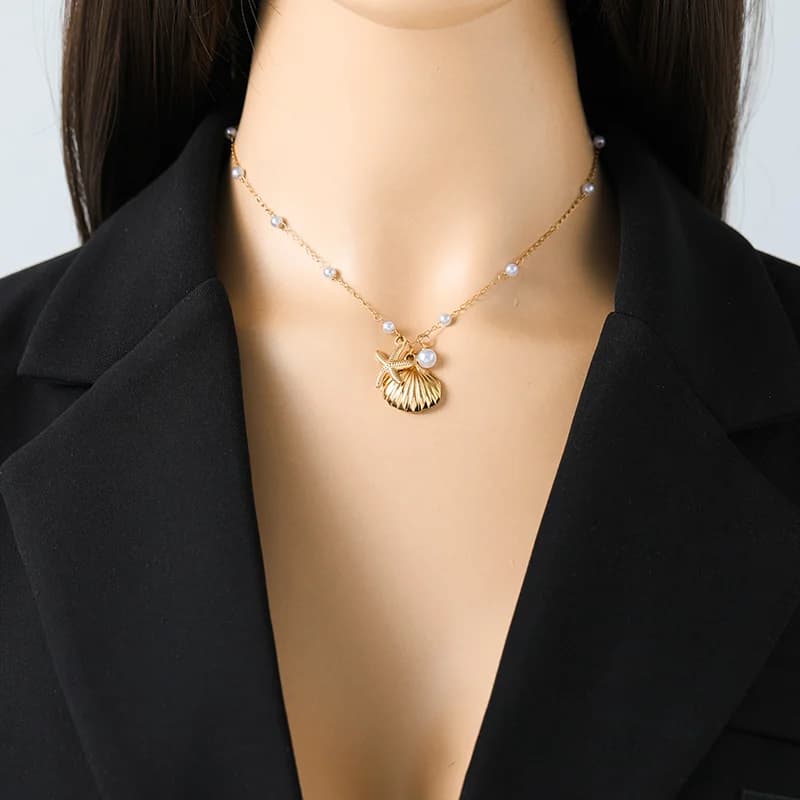 Collana pendente stella marina conchiglia e perla in acciaio inox