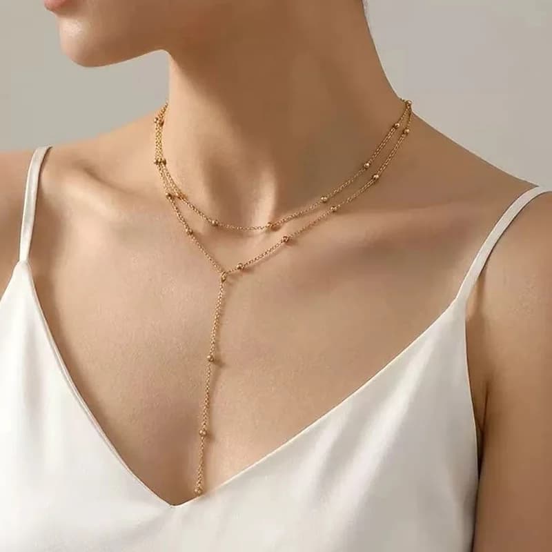 Collana pendente a Y lunga delicata con sfere dorate