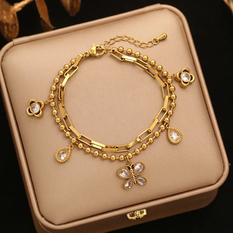 Braccialetto charm fiore e stella con perle