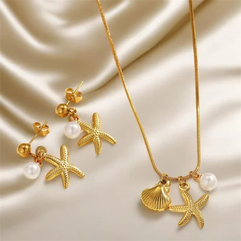 Set collana e orecchini con stella marina, perle e conchiglie