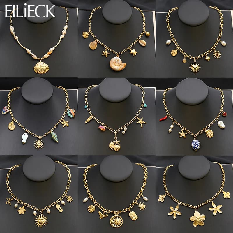 Collana pendente oro con stella marina, conchiglia e sole